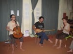 Three musicians and their instruments thinking and playing