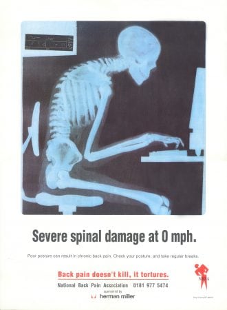 Spinal Damage Poster from the National Back Pain Association, showing a skeleton at a desk - he should have gone to Posture Clinic!